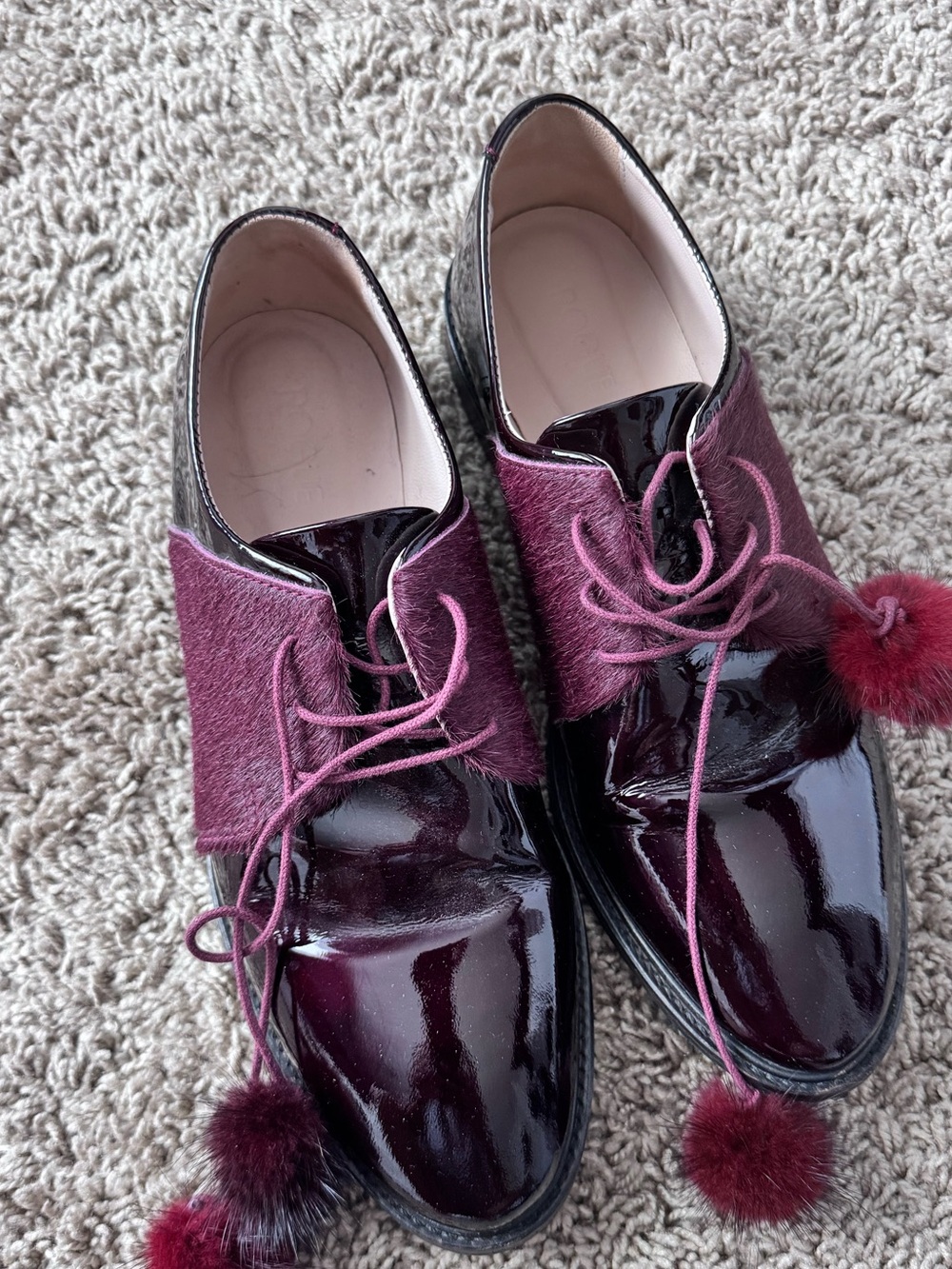 Rogue Burgundy Patent Lace-Up Flats with Pom Pom Accents